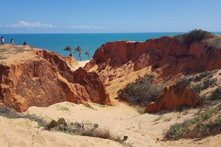 Reddish cliffs and blue sea at Morro Branco — Morro Branco