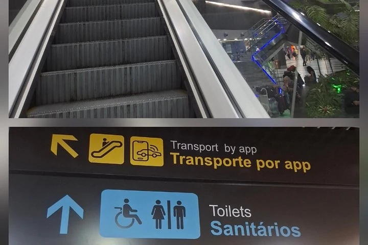 Panneau de transport par application près d'un escalator à l'aéroport de Recife