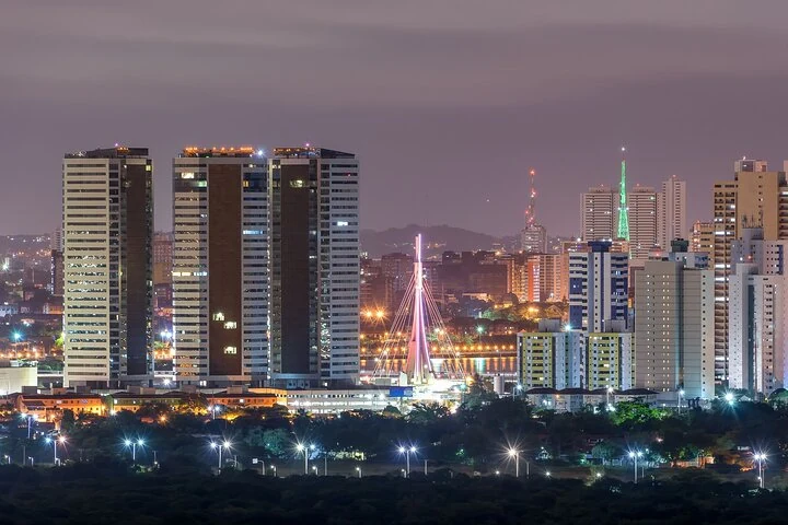 Illuminated buildings and bridge in the Recife night skyline