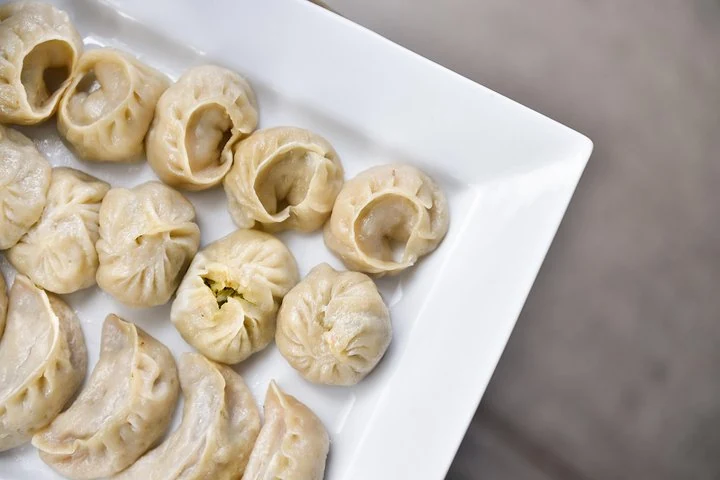 Plate of dumplings served on a Kensington Market food tour