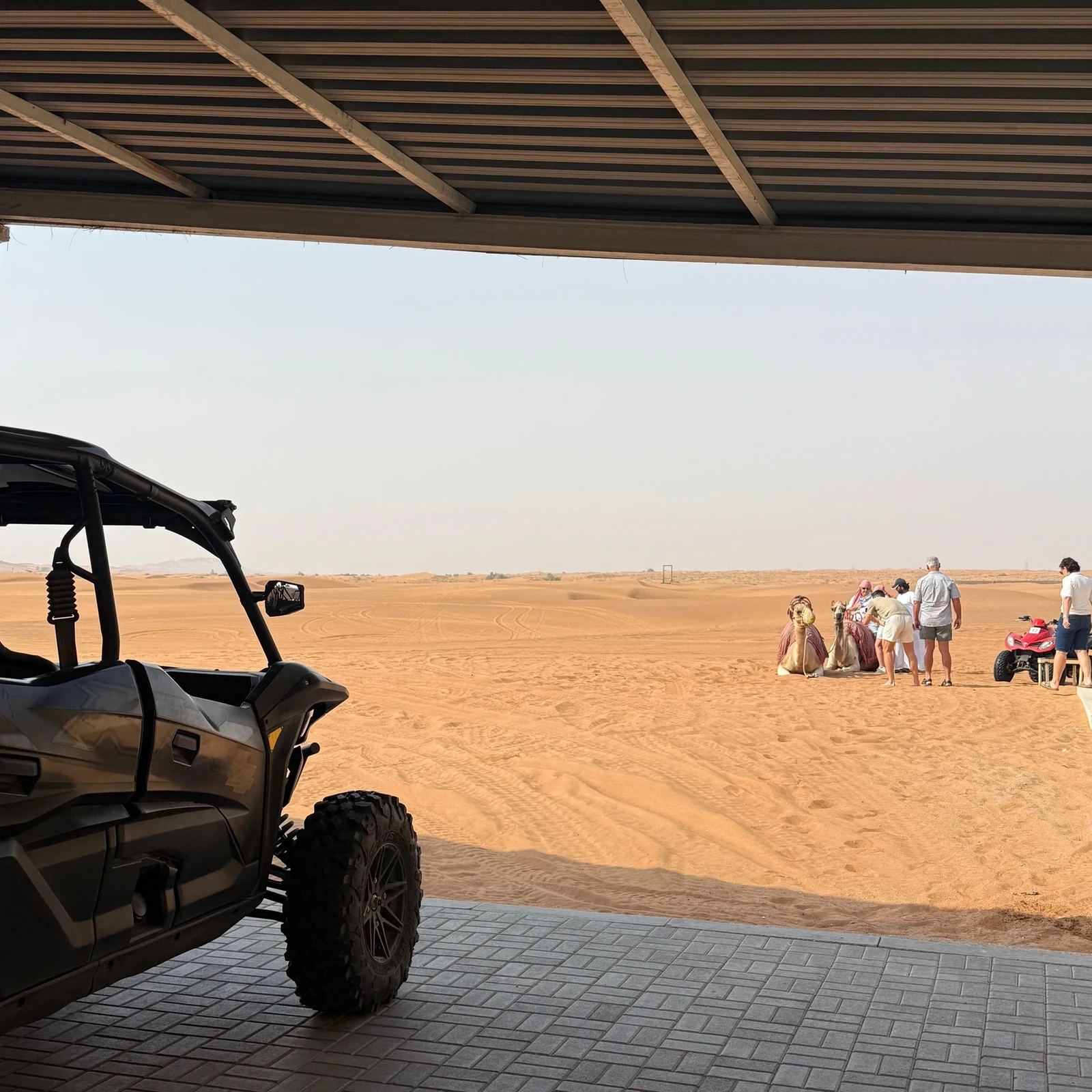 Polaris RZR dune buggy in Dubai with sandboarding and camel ride