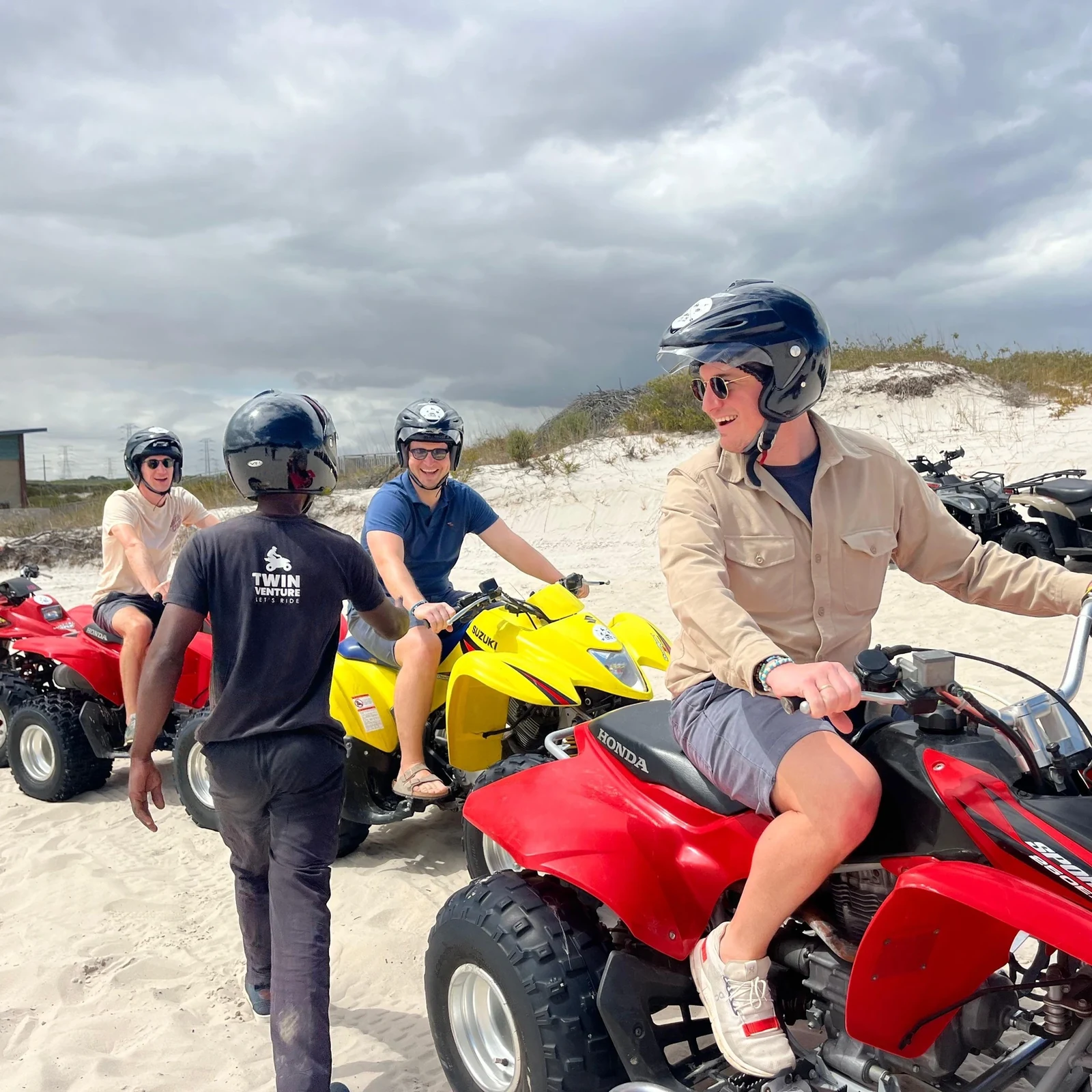 Quad biking and sandboarding among the white Atlantis Dunes
