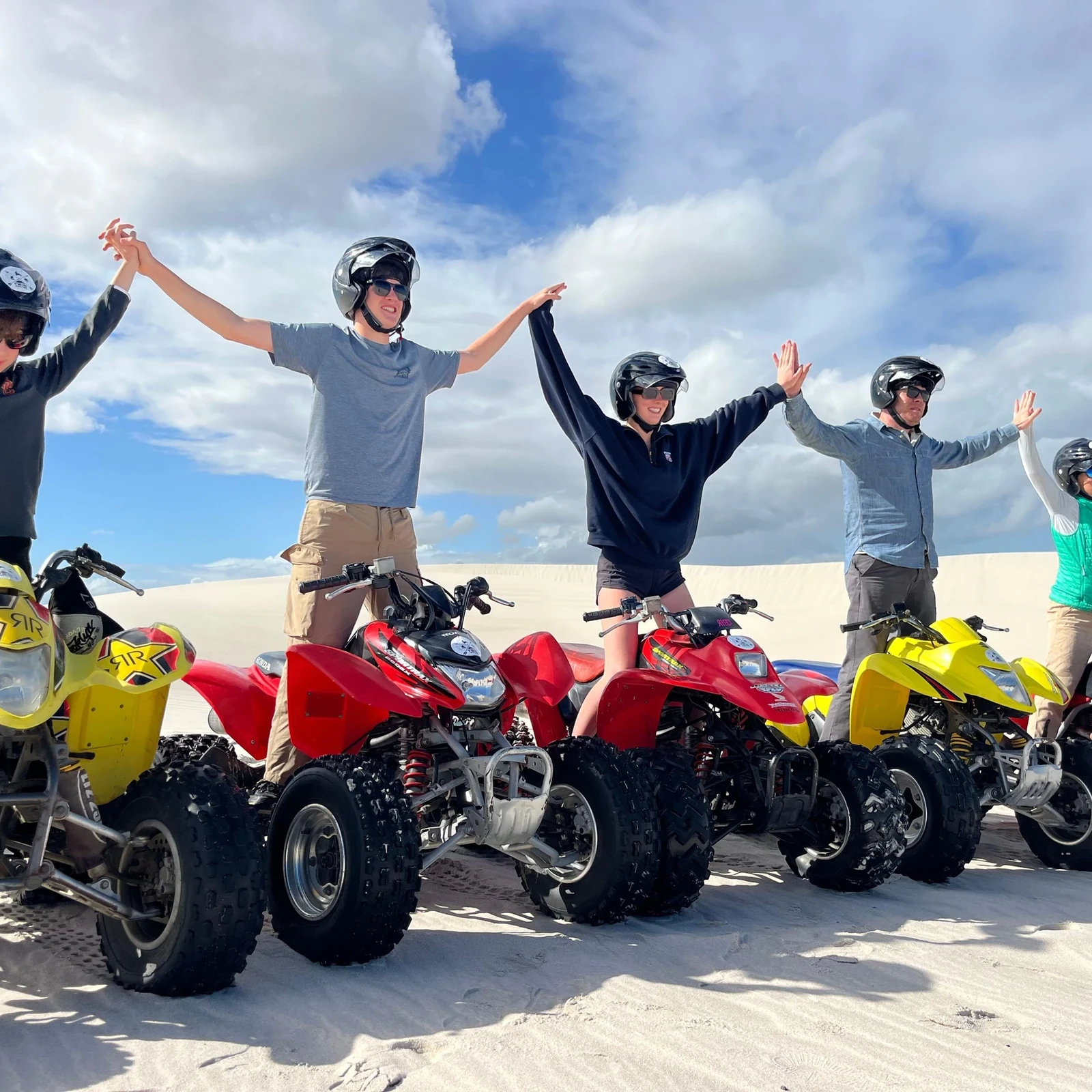 Quad biking and sandboarding among the white Atlantis Dunes