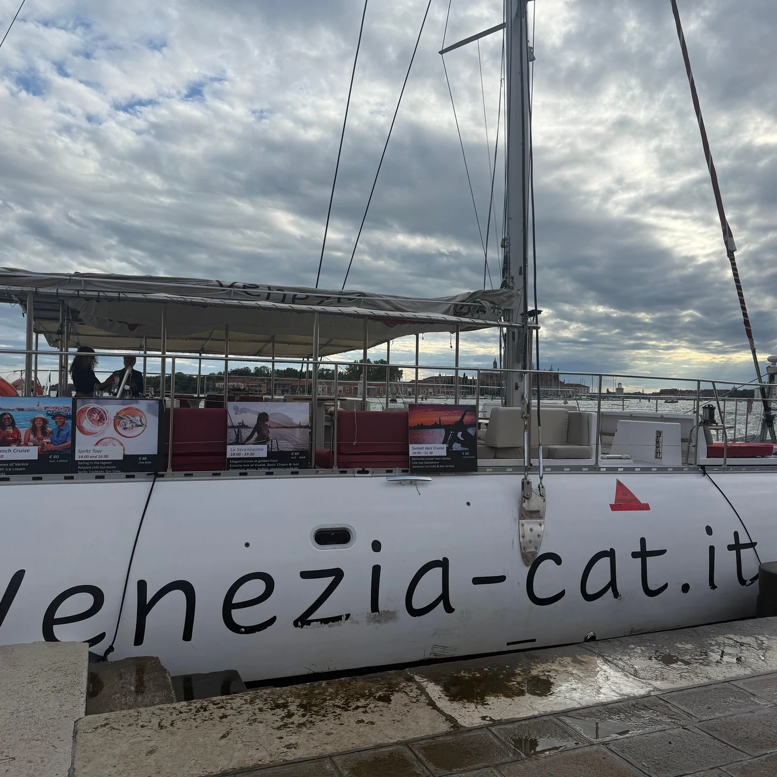 See Venice at sunset from a catamaran