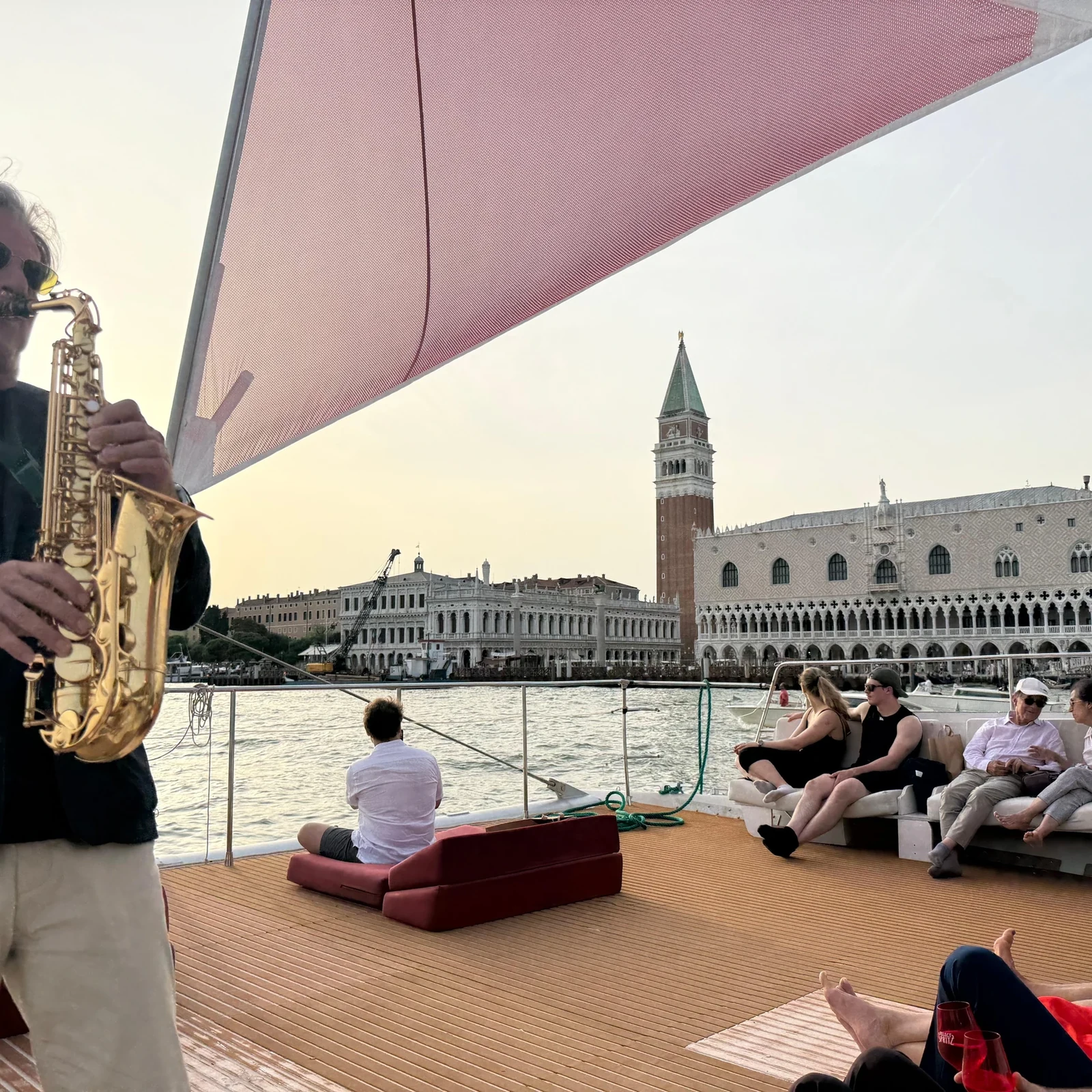 See Venice at sunset from a catamaran