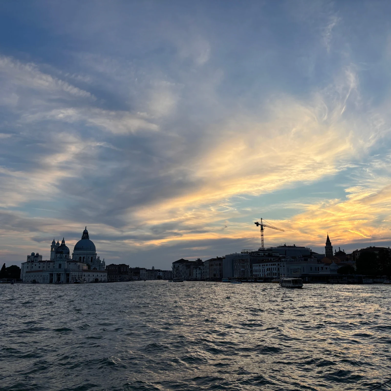 See Venice at sunset from a catamaran