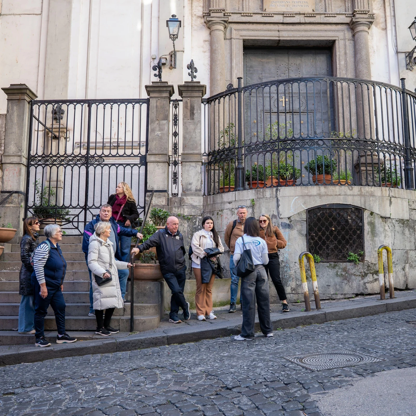 Ride up to Vomero and discover Naples on foot downhill