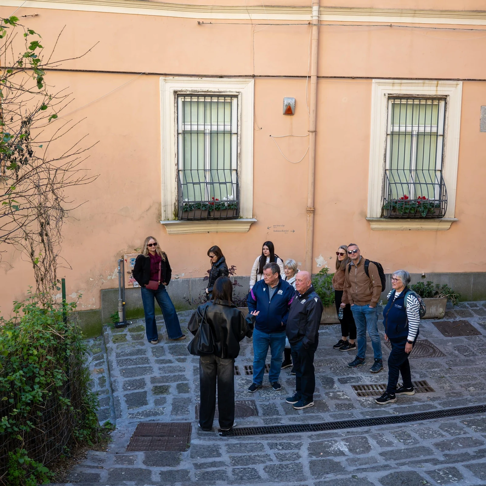 Ride up to Vomero and discover Naples on foot downhill