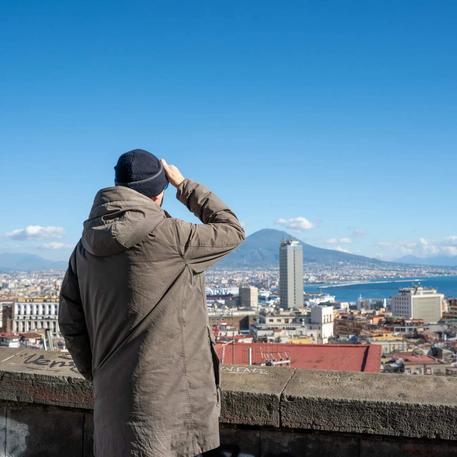 Ride up to Vomero and discover Naples on foot downhill