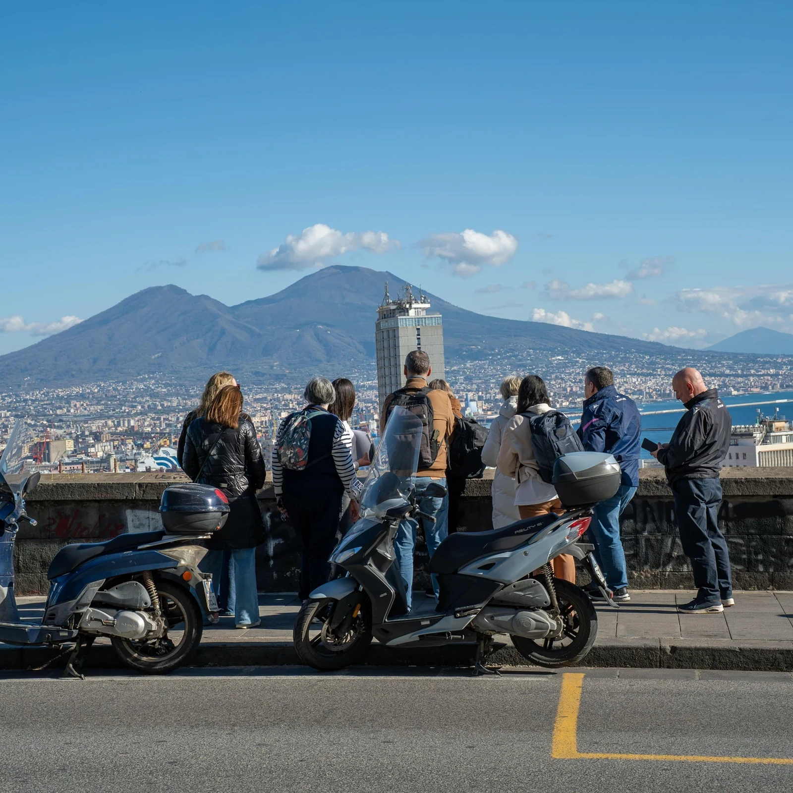 Ride up to Vomero and discover Naples on foot downhill