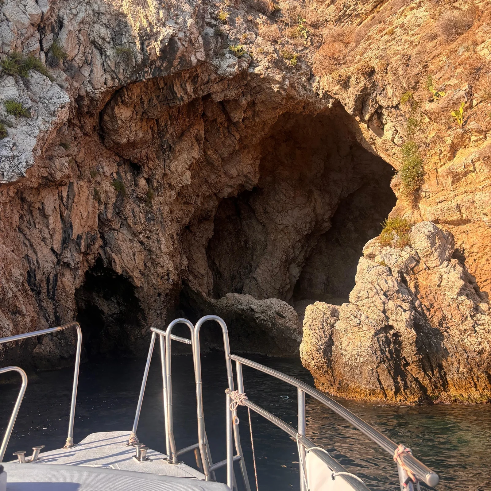 See Taormina from the sea and look for dolphins at sunset