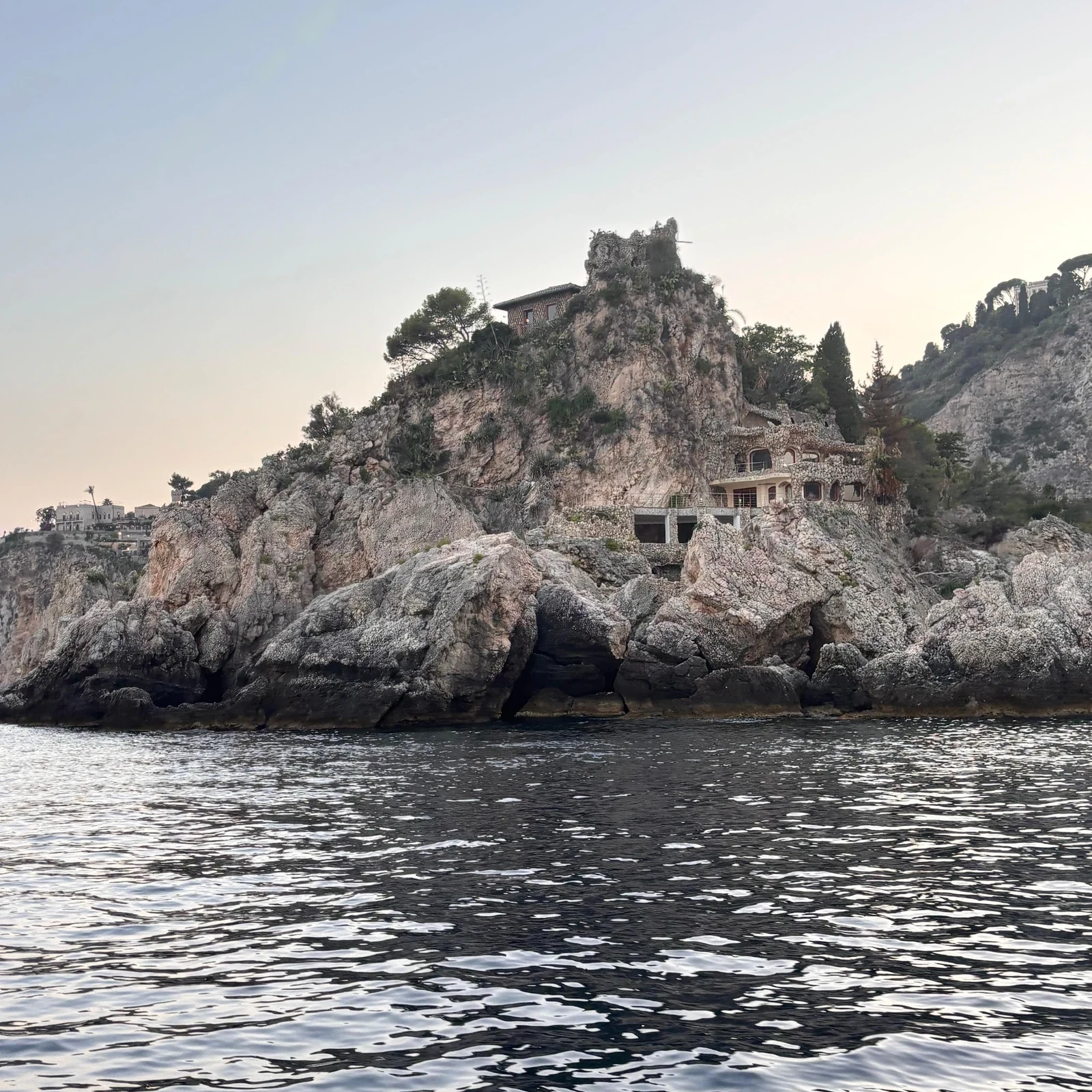 See Taormina from the sea and look for dolphins at sunset