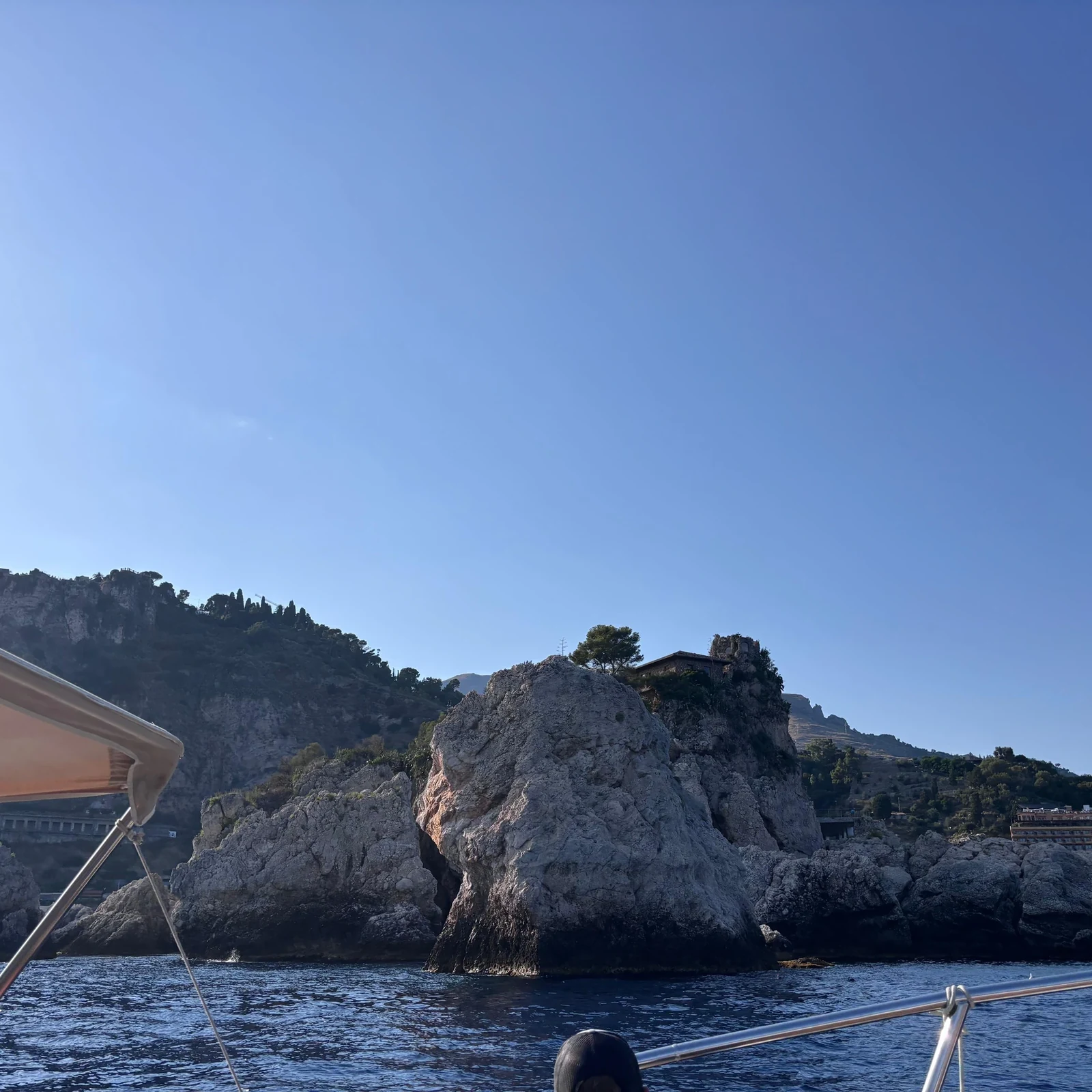 See Taormina from the sea and look for dolphins at sunset
