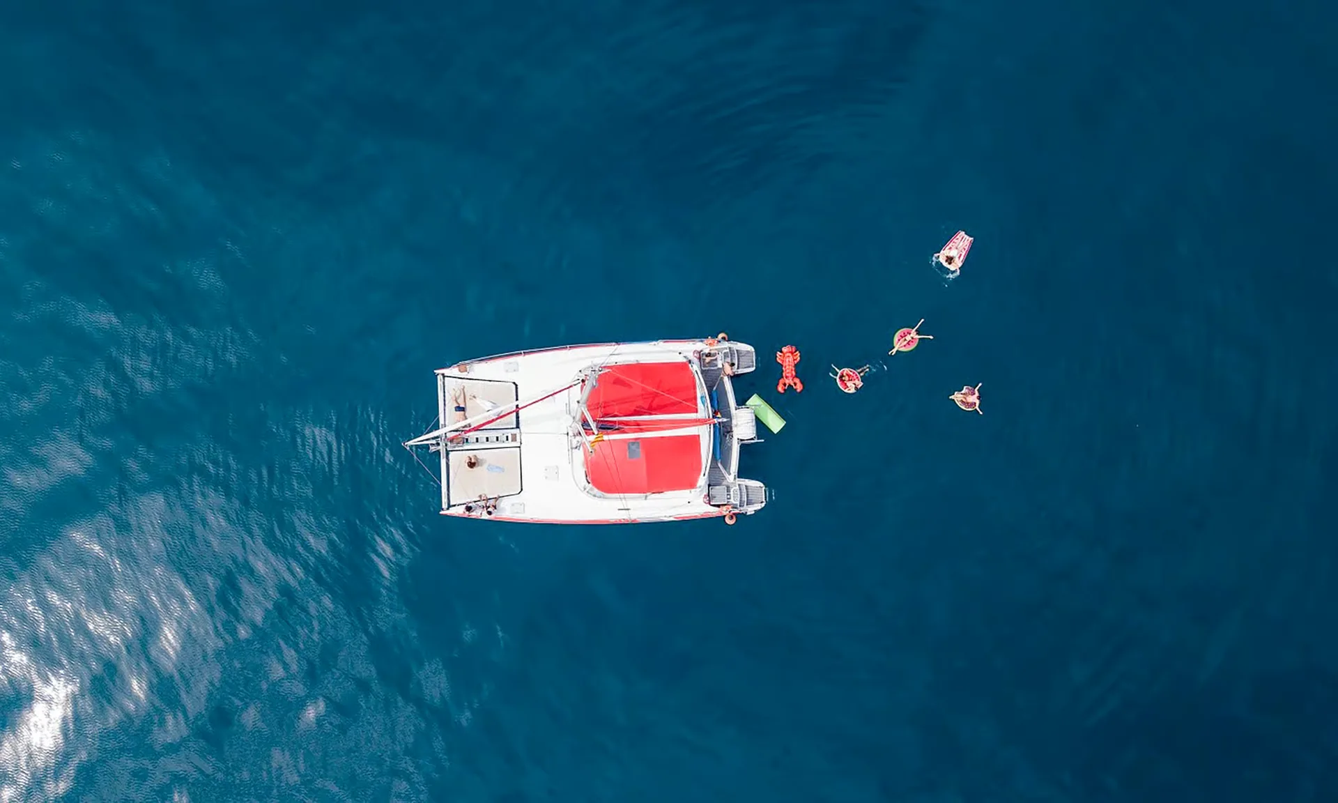 Sail along Barcelona’s coast by catamaran with a tapa and drink